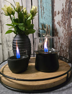 Tischkamin Amarylli schwarz mit Vase auf einem Tablett